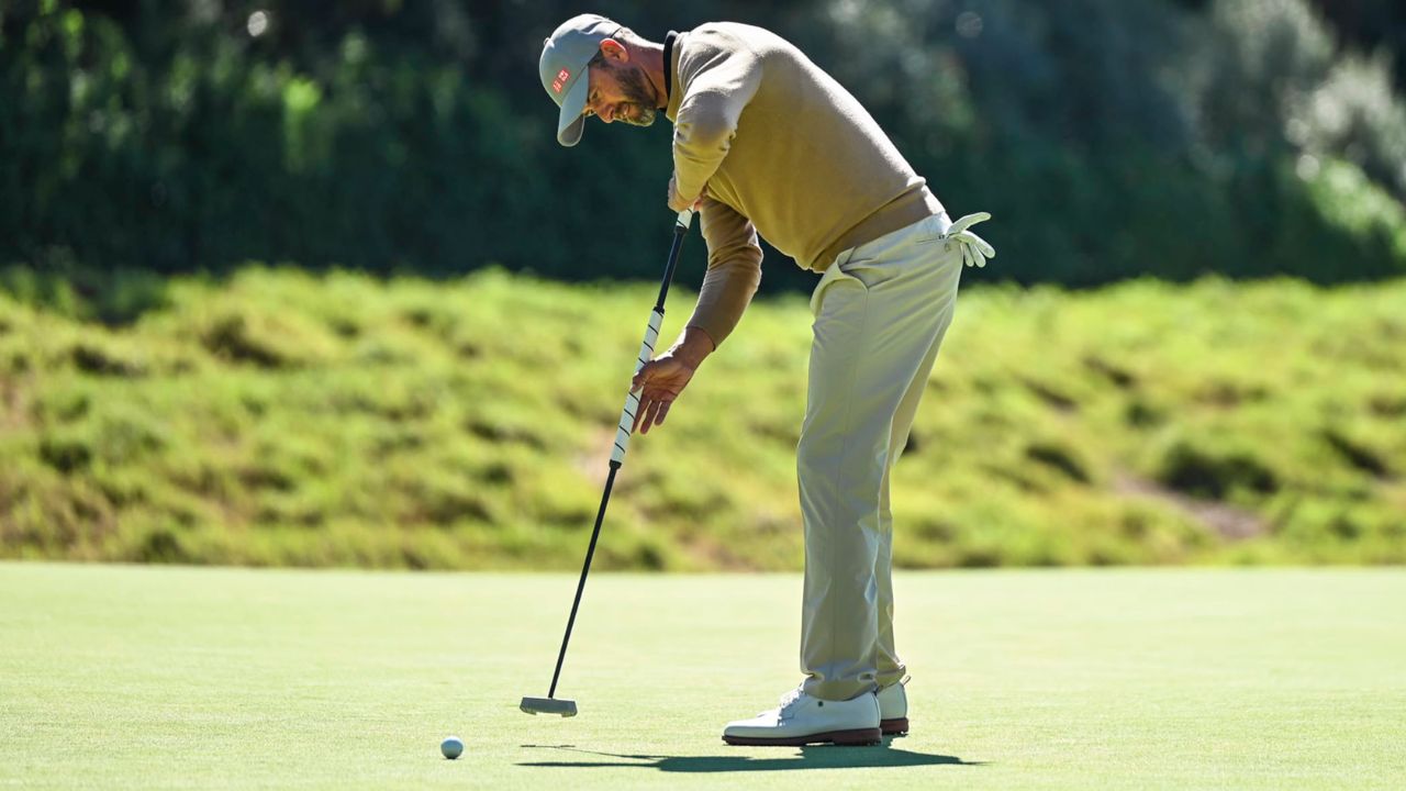 Adam Scott uses a broomstick putter